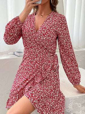 Red floral wrap mini dress with long sleeves and a V-neckline.