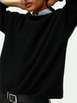 Black oversized brushed knit crewneck sweater with a soft texture.