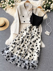 Floral midi dress with black cami top and sheer overlay, paired with a cream double-breasted blazer.