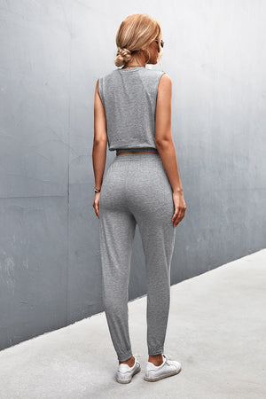 Gray cropped muscle tank and jogger set with elastic waistband and cuffs.