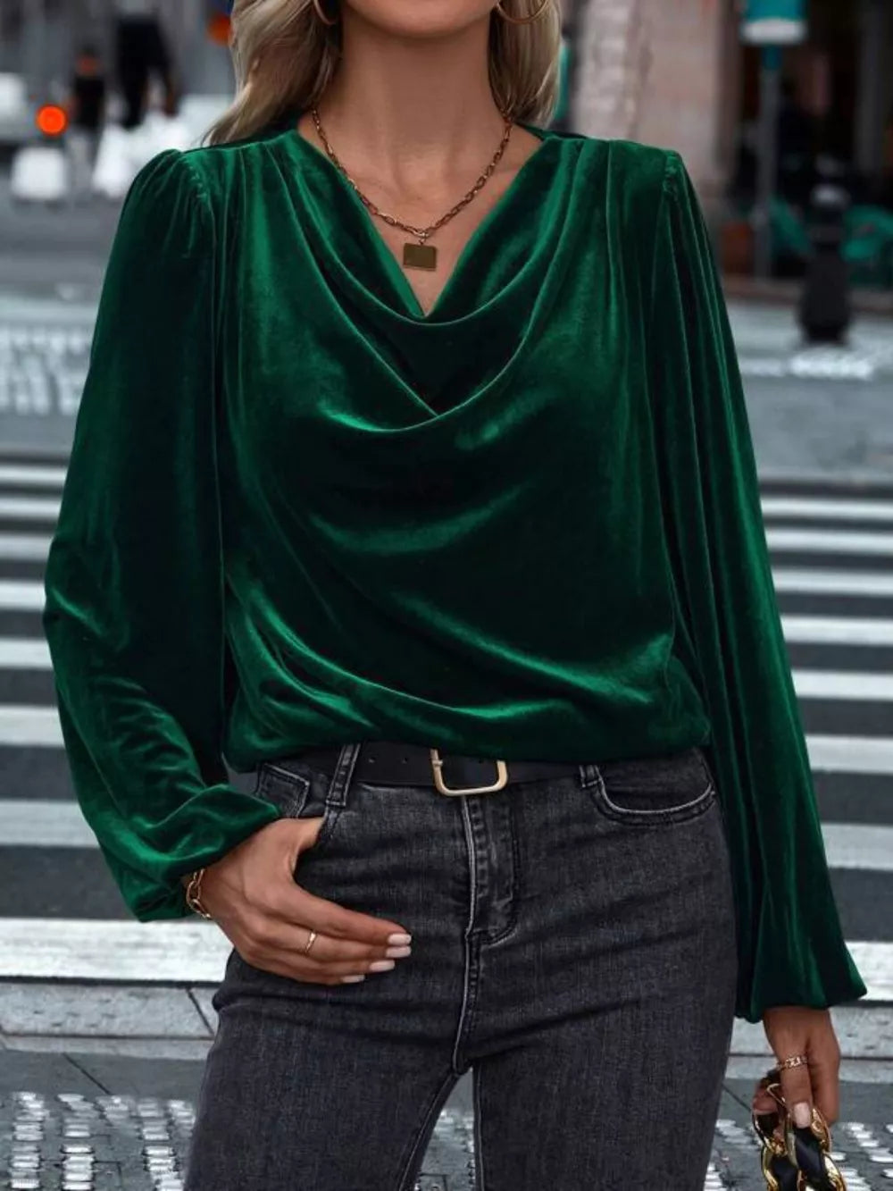 Dark green velvet cowl neck blouse with long sleeves and puffed shoulders.