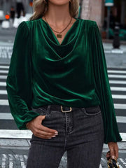 Dark green velvet cowl neck blouse with long sleeves and puffed shoulders.