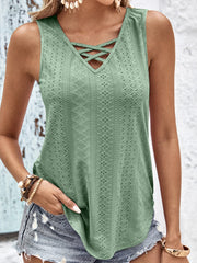 Sage eyelet tank top with crisscross neckline and textured pattern.
