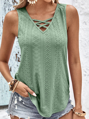 Sage eyelet tank top with crisscross neckline and textured pattern.