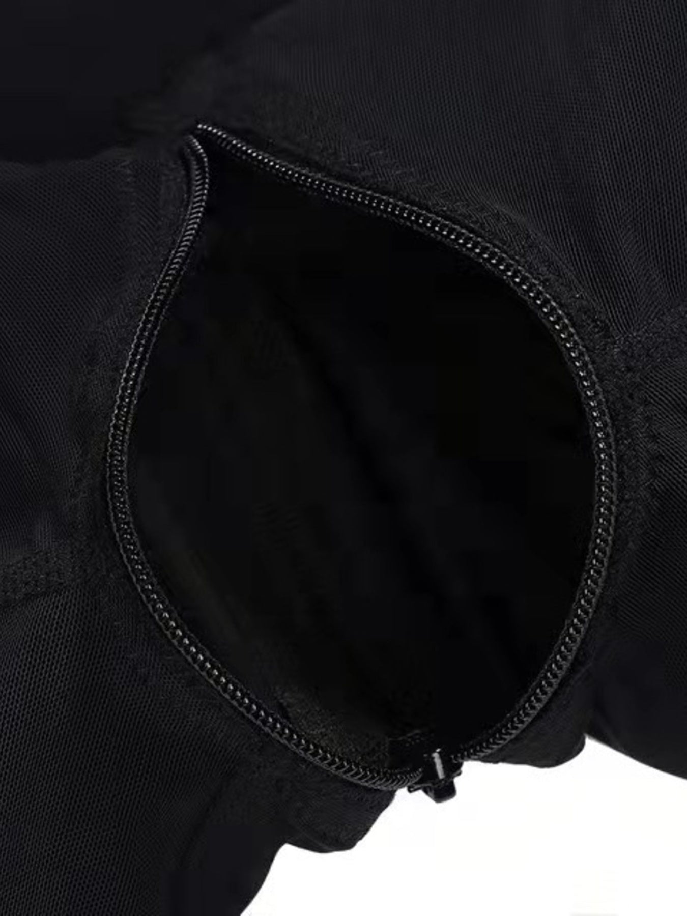 Black shaping romper with a discreet zipper detail.