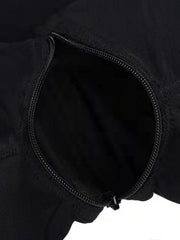 Black shaping romper with a discreet zipper detail.