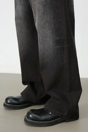 Faded dark wide-leg denim trousers with a relaxed fit.