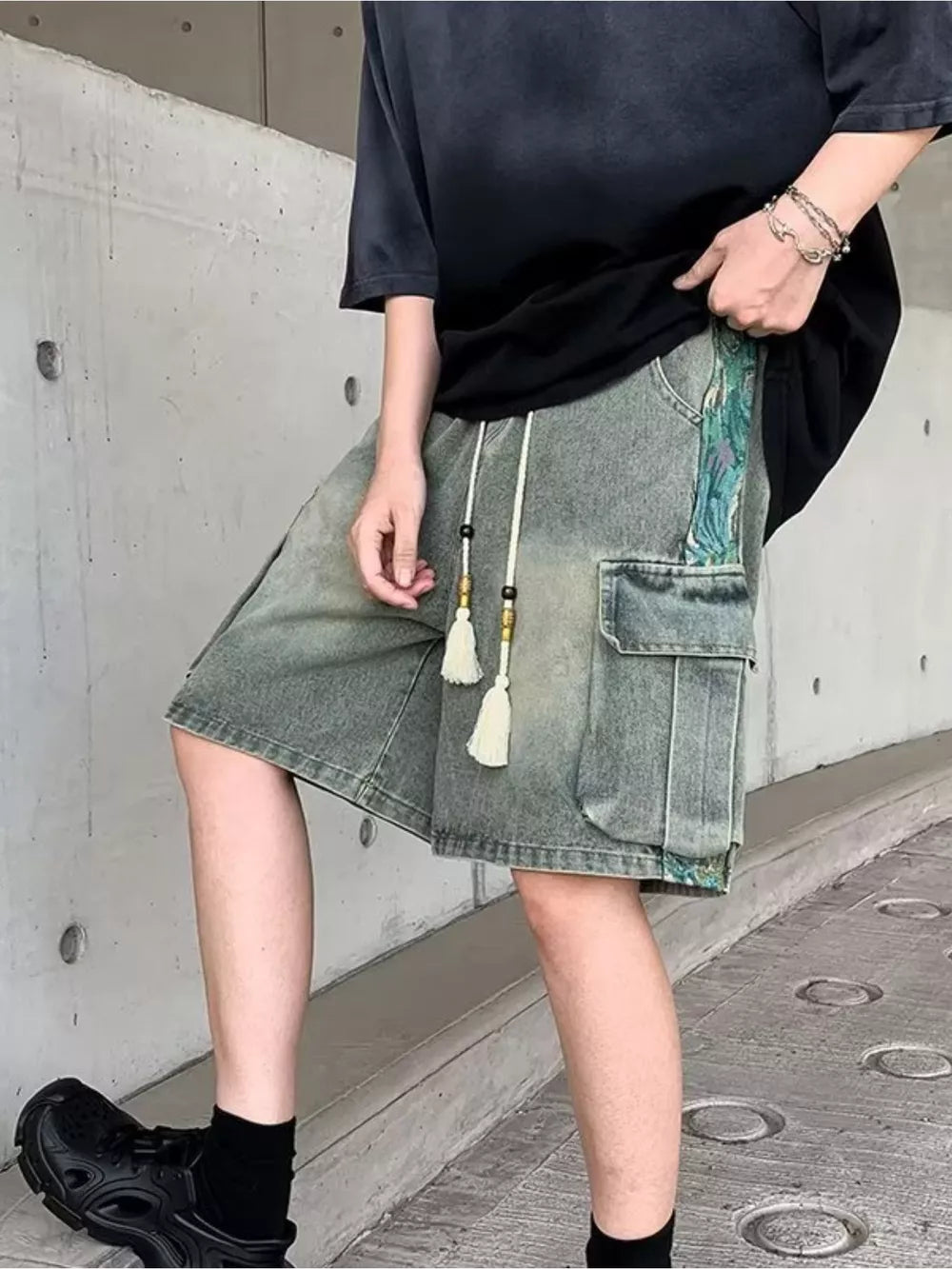 Vintage cargo denim shorts in Air Force Blue with braided drawstring and tassel details.
