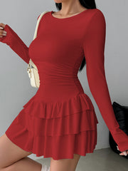 Red long sleeve mini dress with tiered ruffle hem and ruched sides.