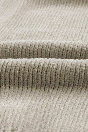 Plush pocket cardigan in khaki with deep V-neck and ribbed texture.
