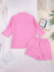 Pink gauze cotton resort shirt and shorts set with buttoned shirt and elastic waist shorts.