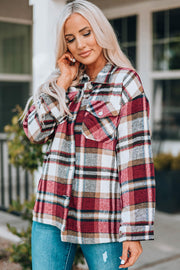 Soft plaid shacket in red with buttoned patch pockets and a collared neckline.