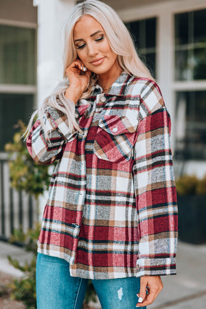 Soft plaid shacket in red with buttoned patch pockets and a collared neckline.