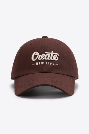 Burnt umber baseball cap with embroidered "Create New Life" text.