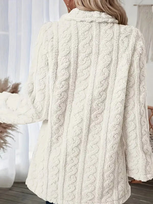 White faux shearling coat with cable knit texture and a cozy collar.