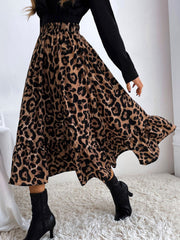 Leopard print midi skirt with tiered ruffles and a flowy silhouette.