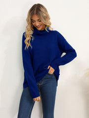 Textured knit oversized turtleneck pullover in dark blue acrylic, with a relaxed fit and dropped shoulders.