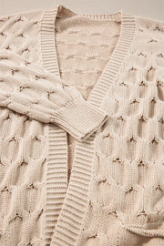 Dust Storm textured open knit cardigan with cable details and ribbed trim.