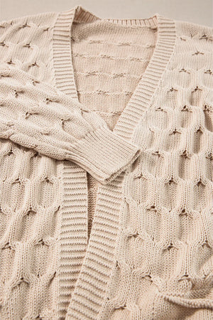 Dust Storm textured open knit cardigan with cable details and ribbed trim.