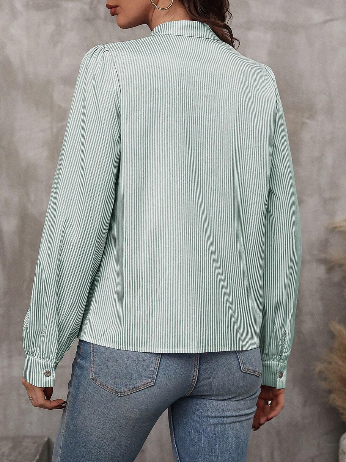 Light Green striped blouse with puffed sleeves and button cuffs.
