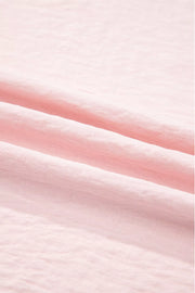 Blush pink polyester blouse with ruffle trim detail