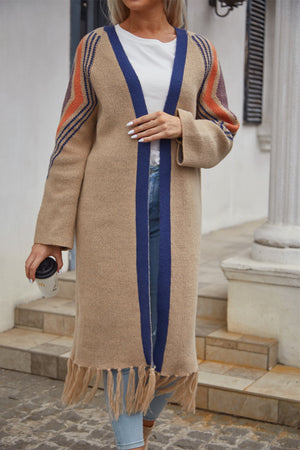 Khaki long cardigan with blue trim and fringed hemline, featuring geometric stripe detail on sleeves.