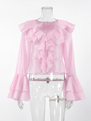 Pink ruffle trim long sleeve blouse with dramatic bell sleeves and ruffled neckline.