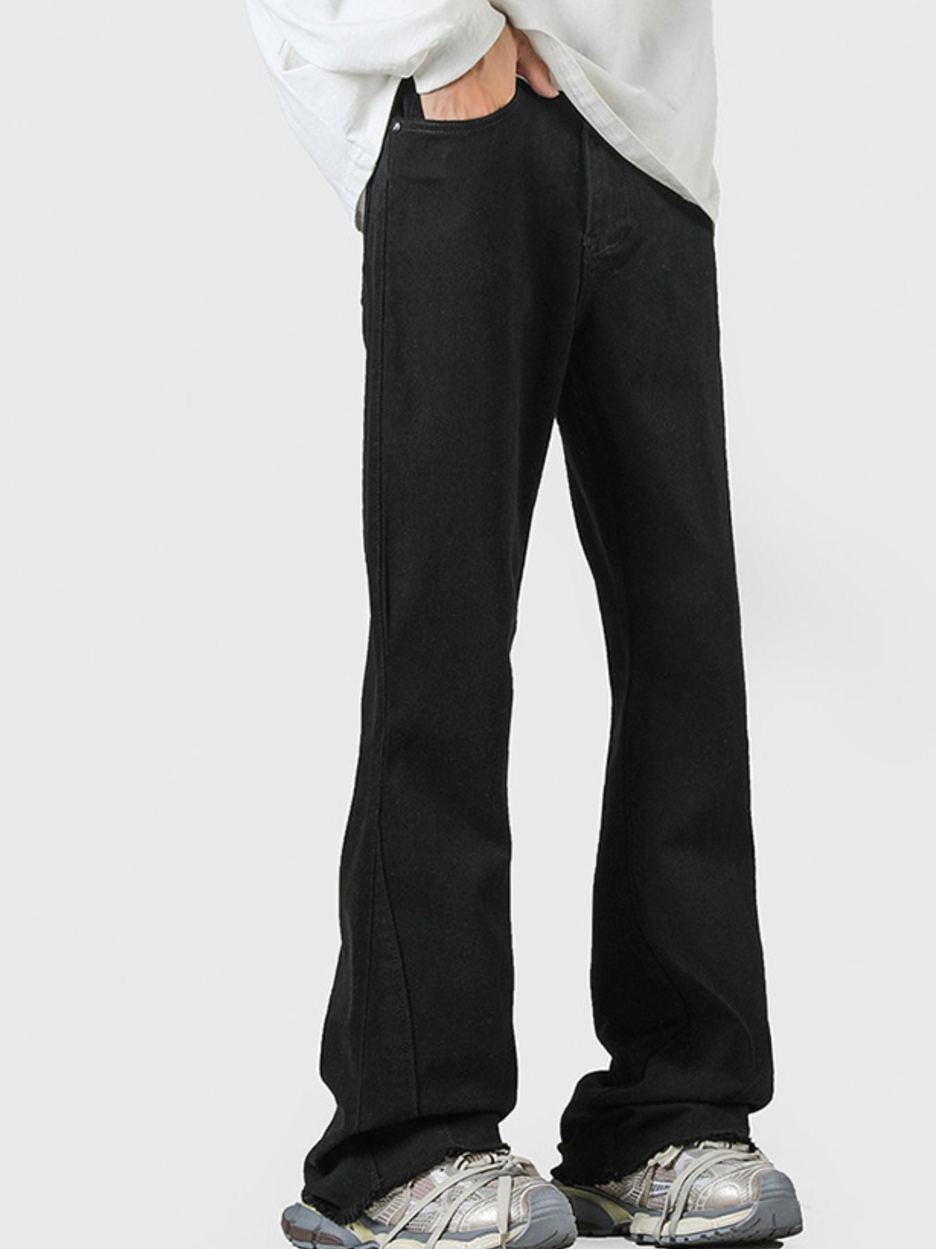 Men's black 100% cotton flare jeans with raw hem detail