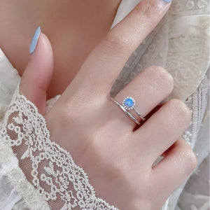 Iridescent opal halo ring on a double band in 925 sterling silver.