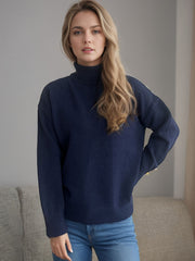 Dark blue relaxed fit turtleneck sweater with ribbed cuffs and hem.