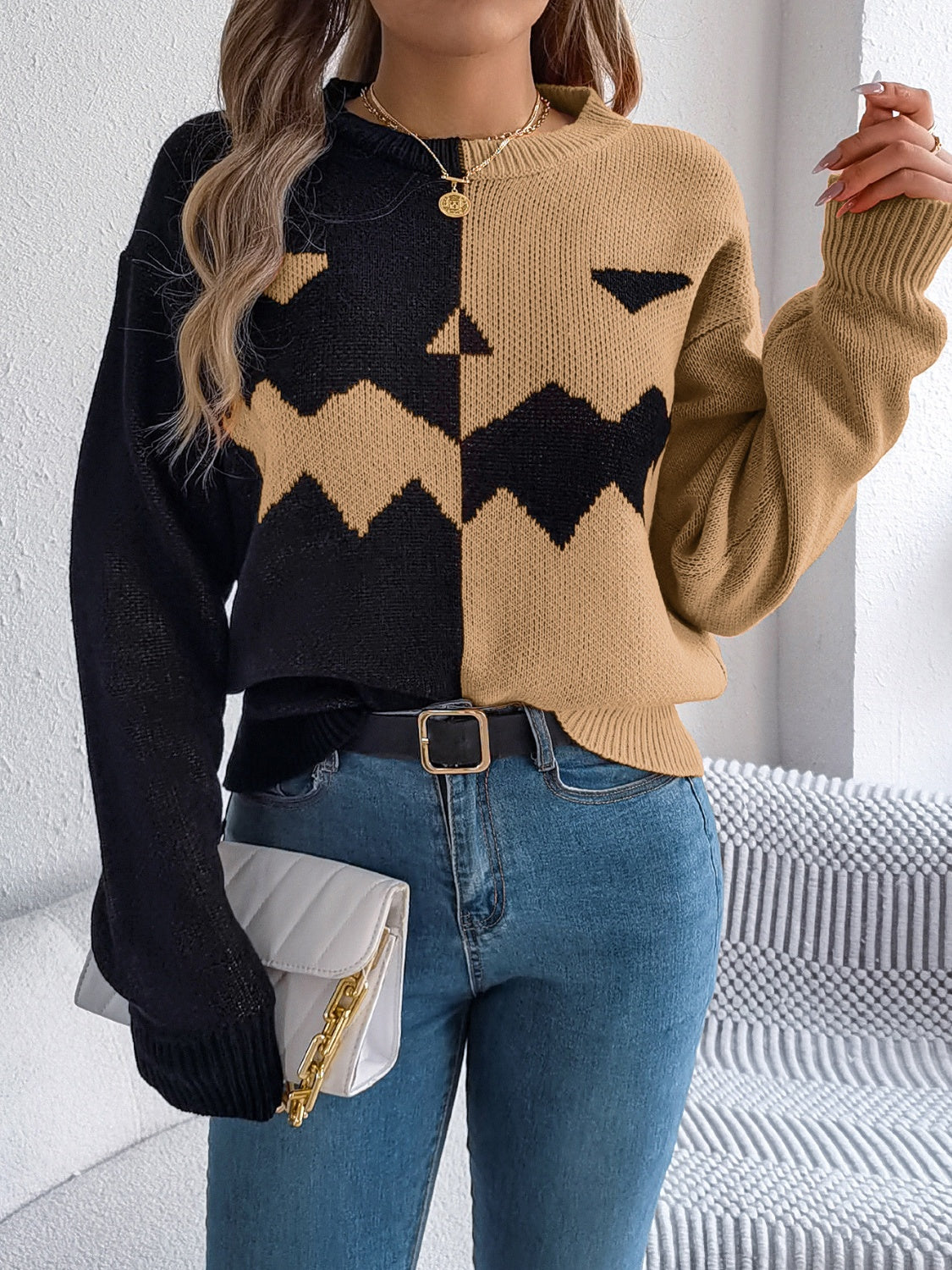 Split-Face Pumpkin Knit Sweater in black and camel with zigzag pattern and crew neck.