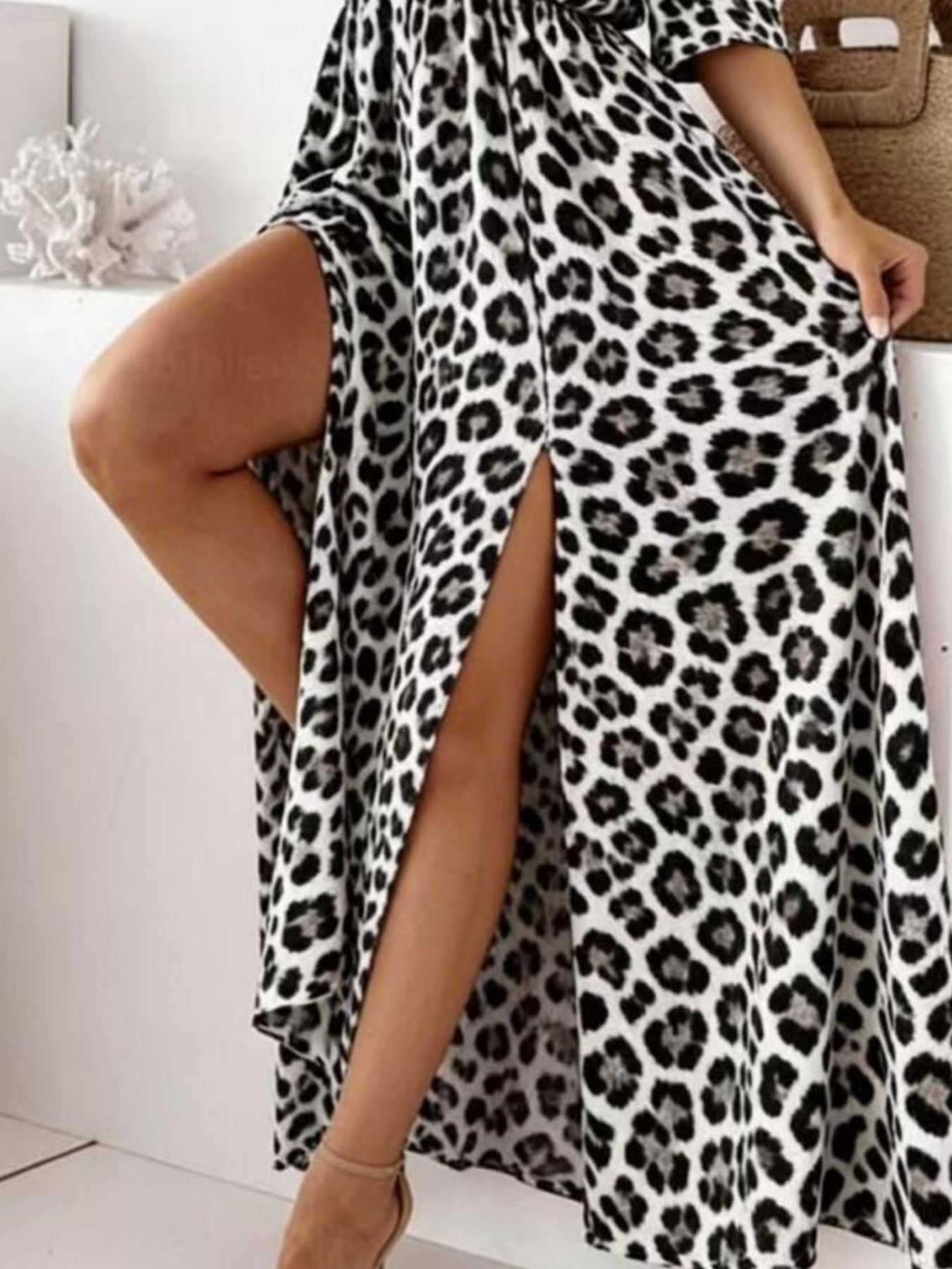 White leopard print cotton blend maxi dress with high slit and cold shoulder detail.