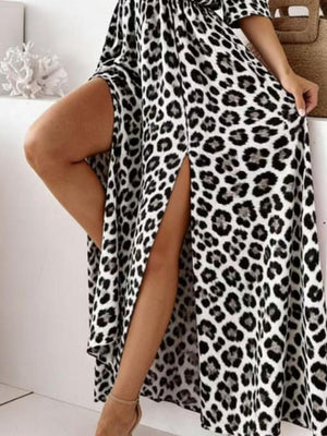 White leopard print cotton blend maxi dress with high slit and cold shoulder detail.