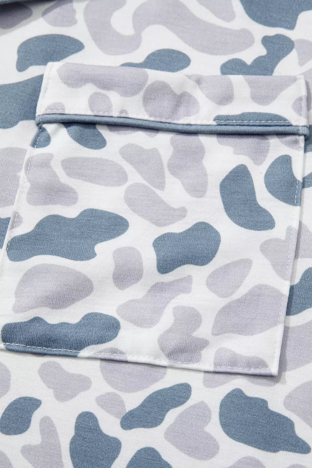 Camouflage print pajama set with blue and grey abstract shapes and a chest pocket.
