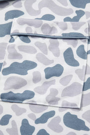 Camouflage print pajama set with blue and grey abstract shapes and a chest pocket.
