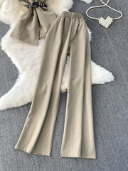 Mocha belted two-piece set with wide-leg pants and pockets.