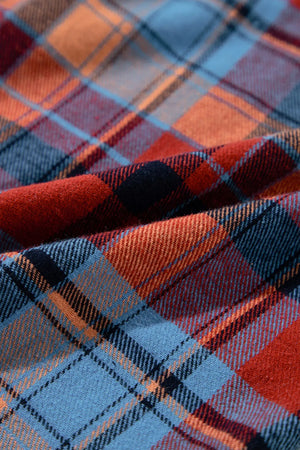 Oversized shacket with button-down collar in orange and deep red plaid fabric.