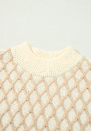 Cream diamond knit sweater with mock neck and ribbed trim.