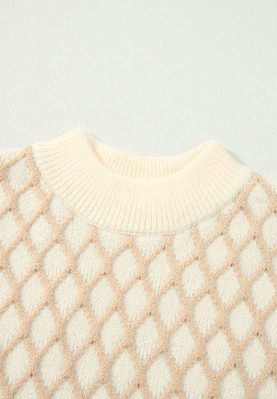 Cream diamond knit sweater with mock neck and ribbed trim.
