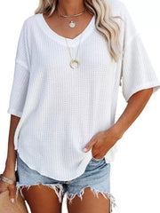 White waffle knit relaxed v-neck t-shirt with short sleeves and a curved hem.