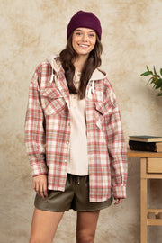 Cozy plaid shacket with sherpa hood in Dusty Pink, featuring buttoned pockets and a relaxed fit.