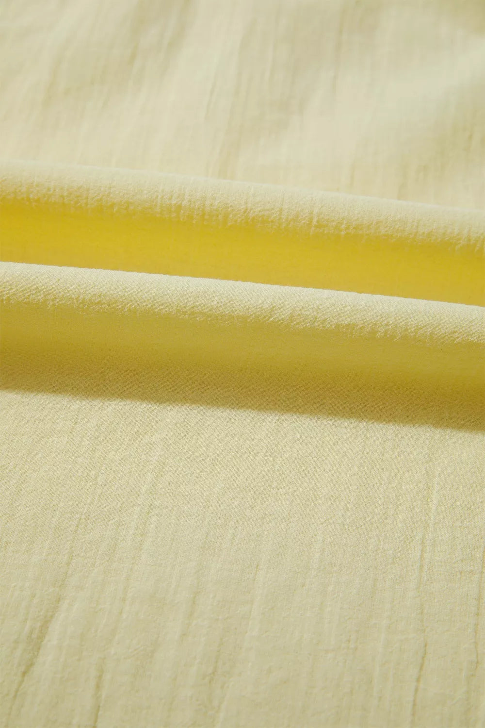 Light yellow cotton blend shirt with textured fabric detail