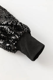 Black sequin sleeve ribbed knit top with waffle knit cuff detail.