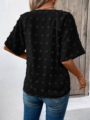 Black Swiss Dot Dream Blouse with short sleeves and textured dots.