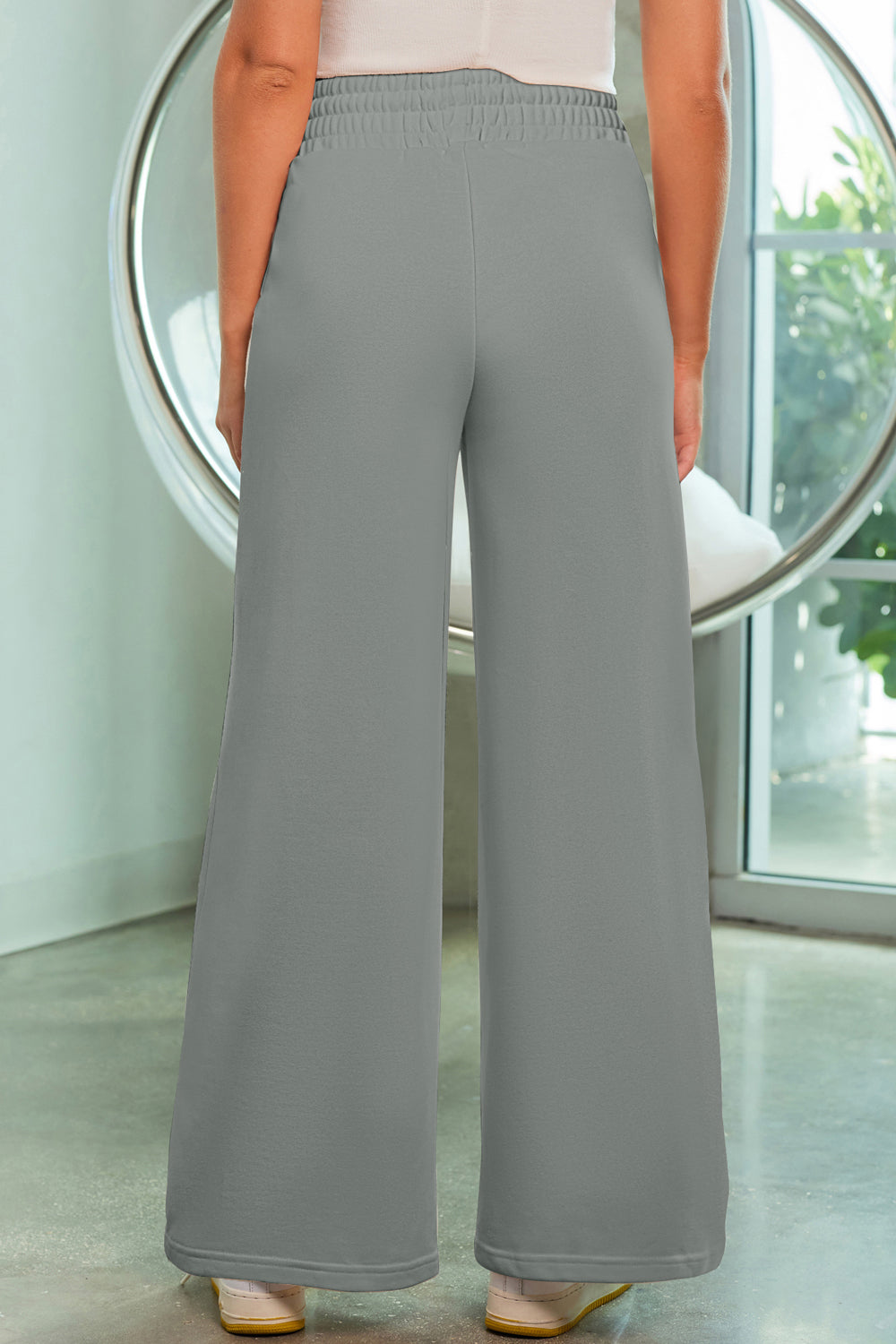 Heather gray palazzo joggers with center seam detail and elastic waistband.