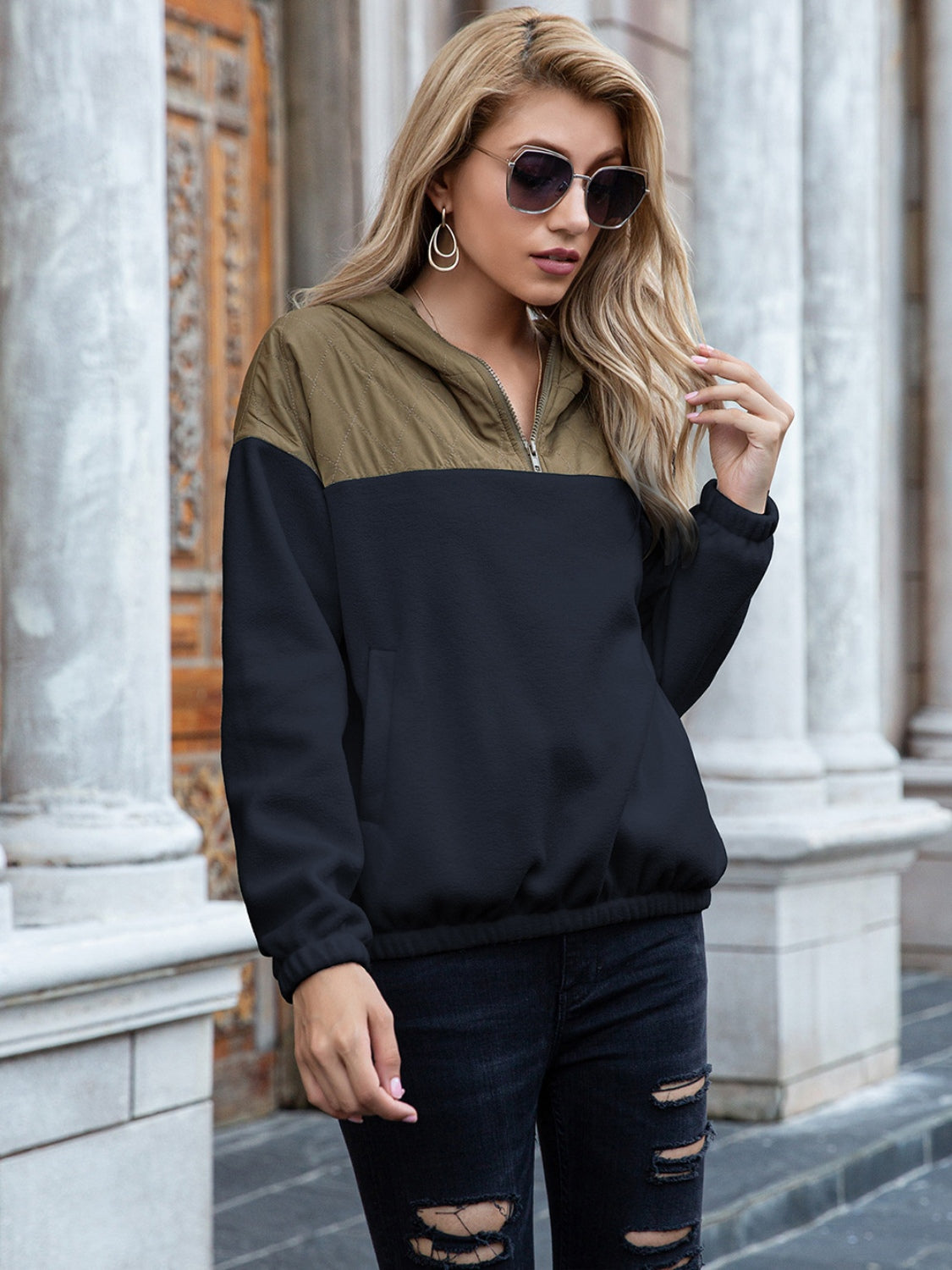 Quilted shoulder block fleece hoodie in dark blue and khaki with quarter zip and pockets.