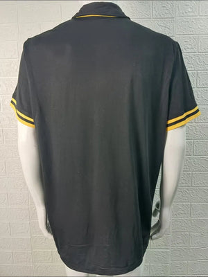 Black polo shirt with yellow trim on collar and sleeves.