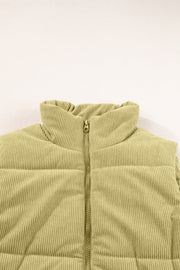 Sage corduroy padded vest with a high collar and zipper detail.