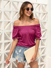 Off-shoulder ruffled sleeve blouse in hot pink with gathered neckline and short puff sleeves.