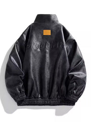 Black oversized snap down jacket with embossed text and elastic cuffs.